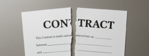 An image of a contract torn in half