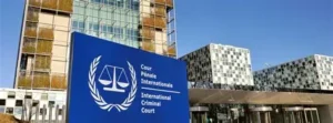 The International Criminal Court in The Hague, with the blue ICC sign in front of a modern glass building complex.